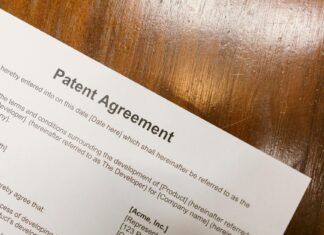 미얀마 특허 및 실용신안 출원 가능 close up shot of a document on a wooden table